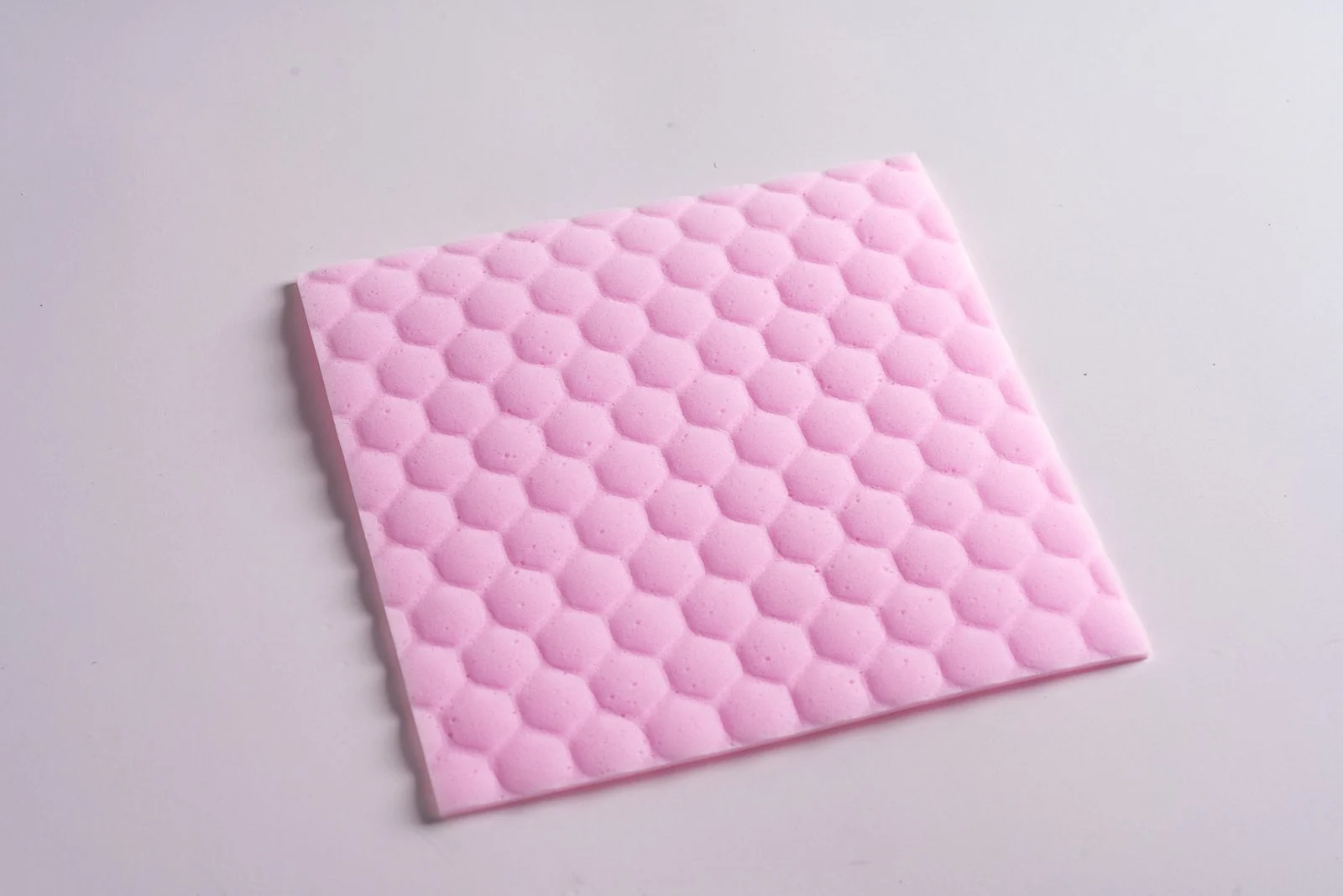 Pink melamine sponge sheet with honeycomb embossing for gentle wall stain removal