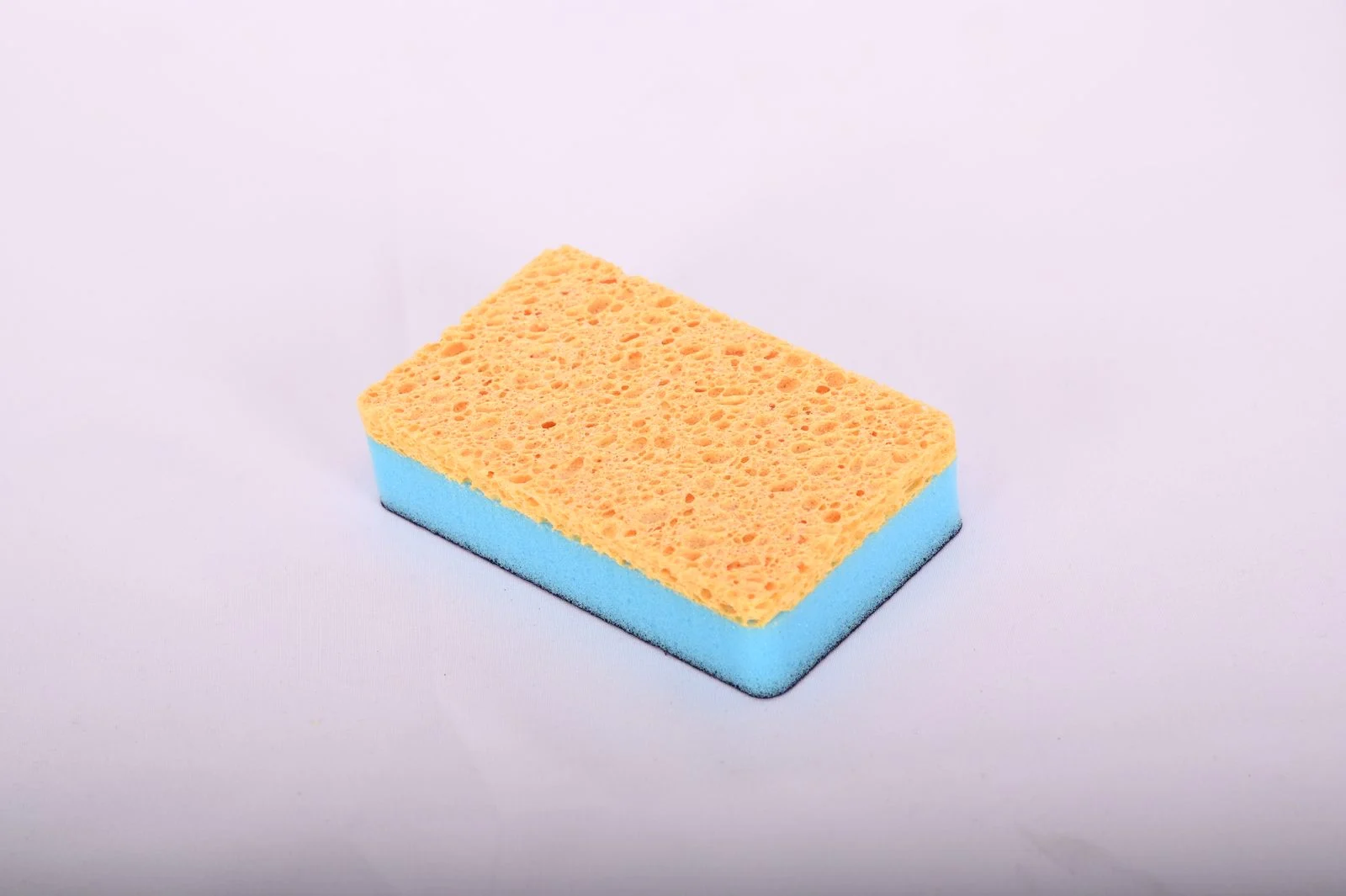 Emery and wood pulp composite scrub sponge for hard water deposits on shower glass