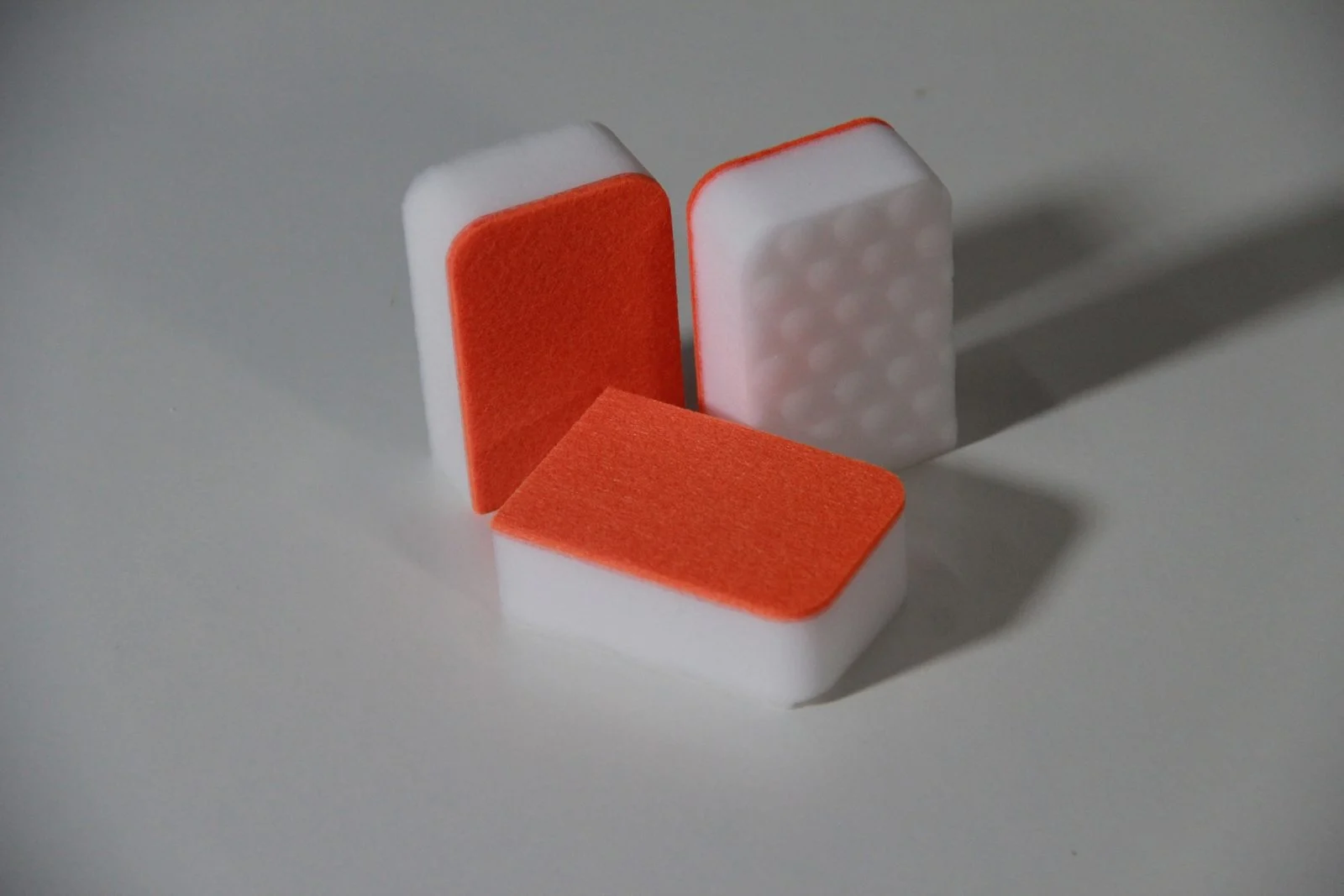 Orange composite scrub sponges with honeycomb embossing for greasy kitchen glass surfaces